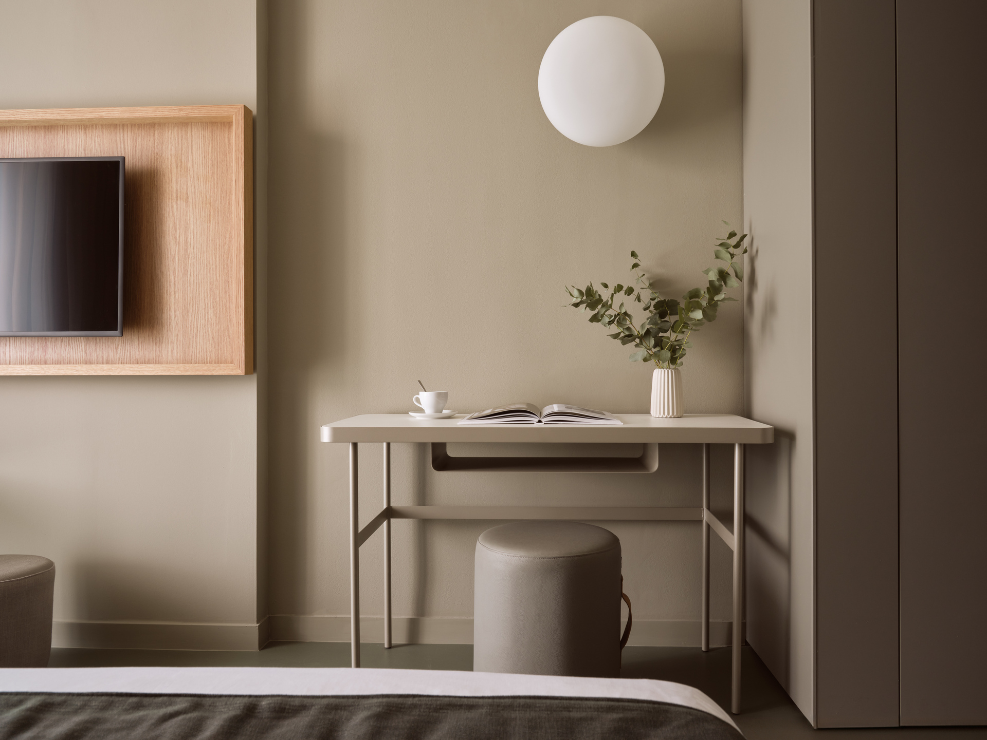 
Superior Room City View at City Hotel with stylish work desk, modern decor, and wall-mounted TV