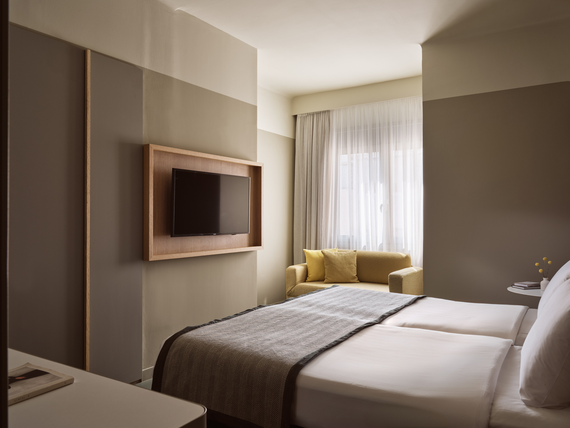 
Superior Room Inner View at City Hotel with twin beds, wall-mounted TV, and comfortable sitting area