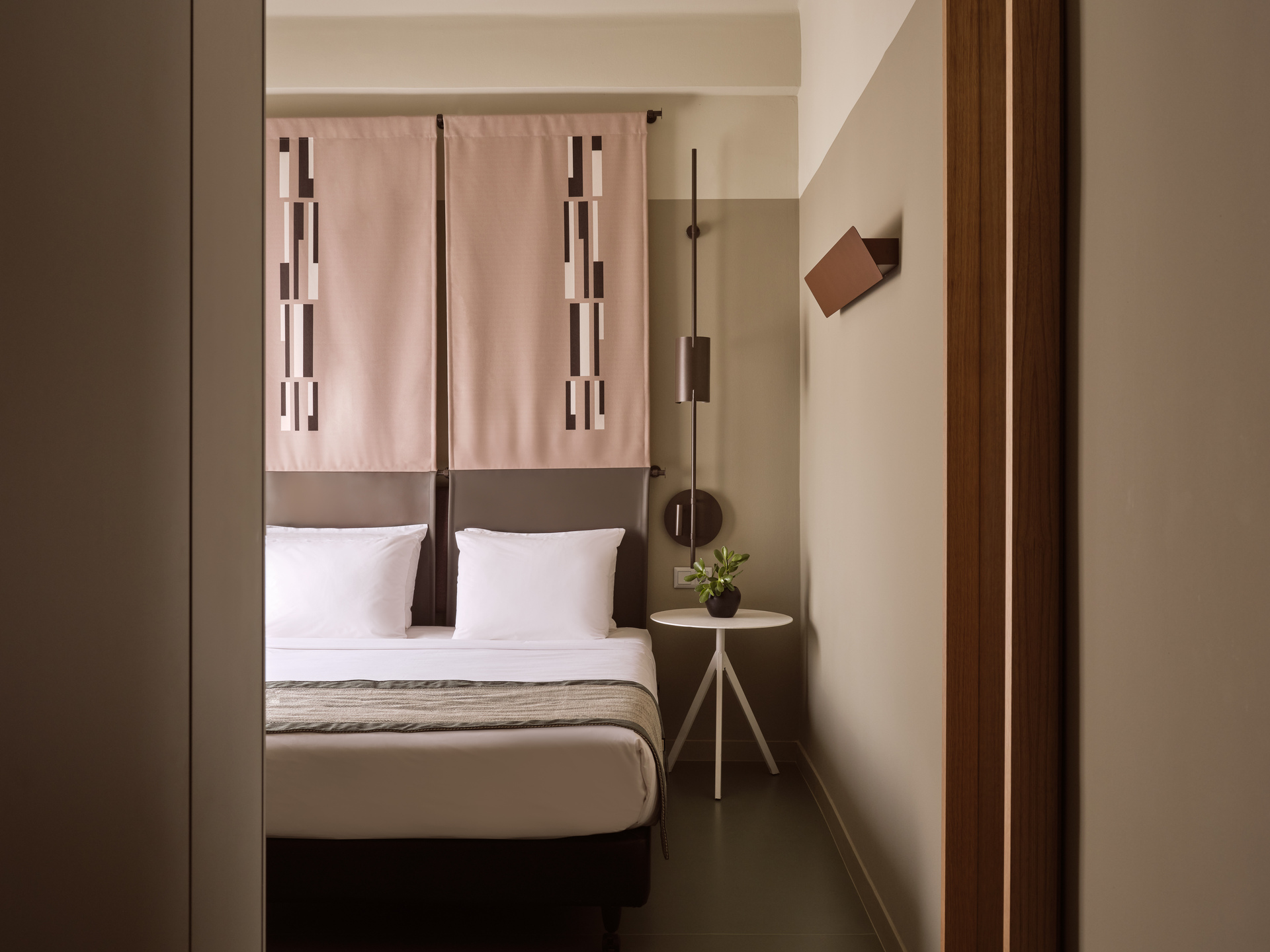 
Standard Room Inner View at City Hotel with double bed, modern geometric decor, and minimalist furnishings