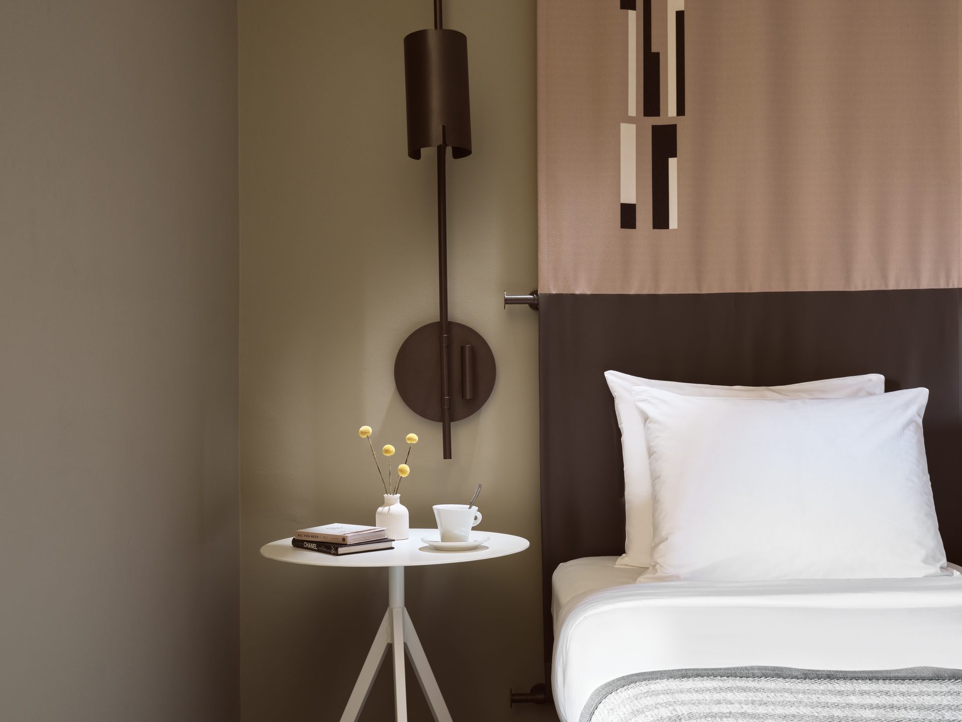 
Superior Room Inner View at City Hotel with single bed, modern wall lamp, and minimalist side table