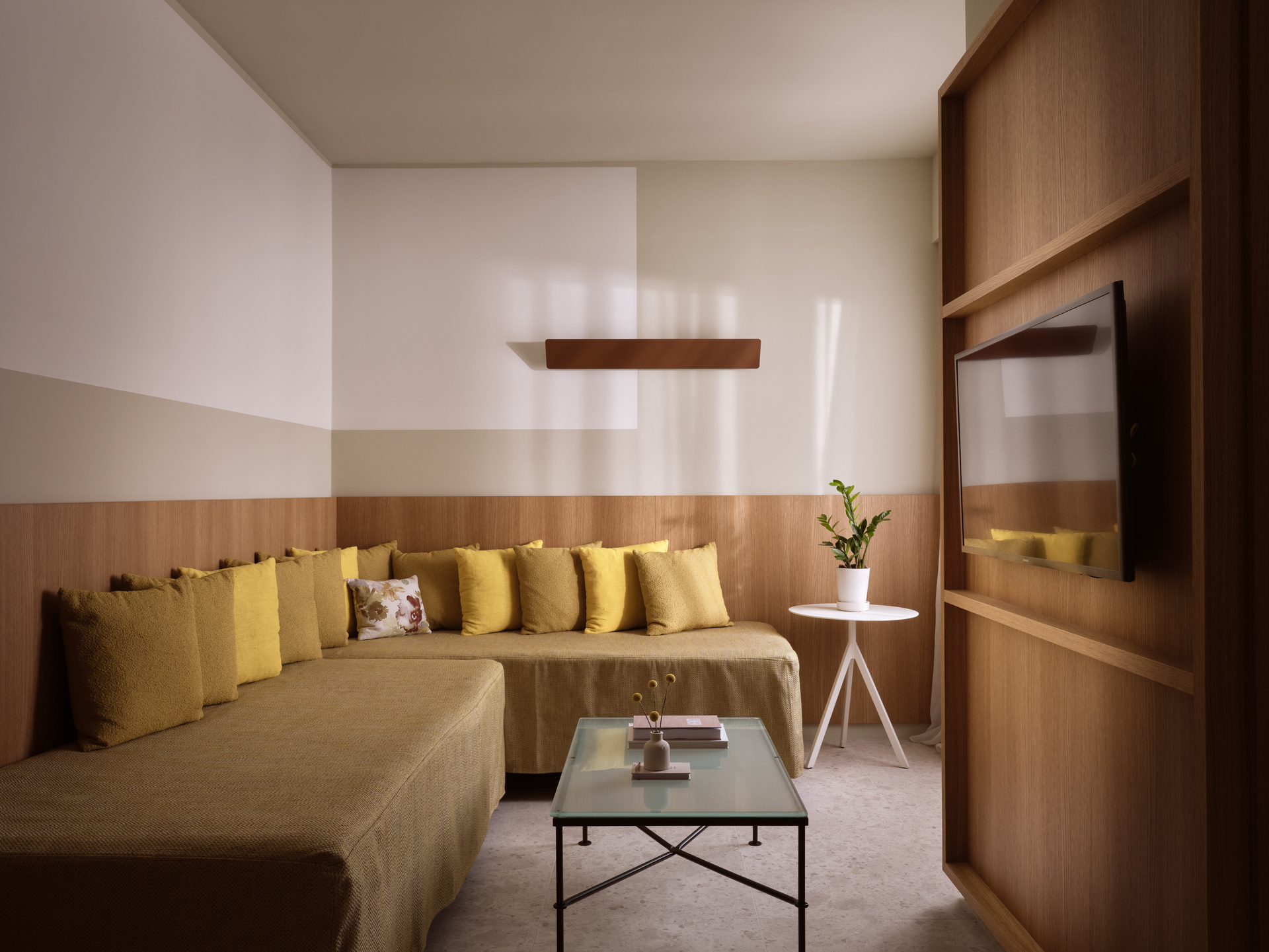 
Junior Suite Inner View at City Hotel with spacious lounge area, modern decor, and flat-screen TV