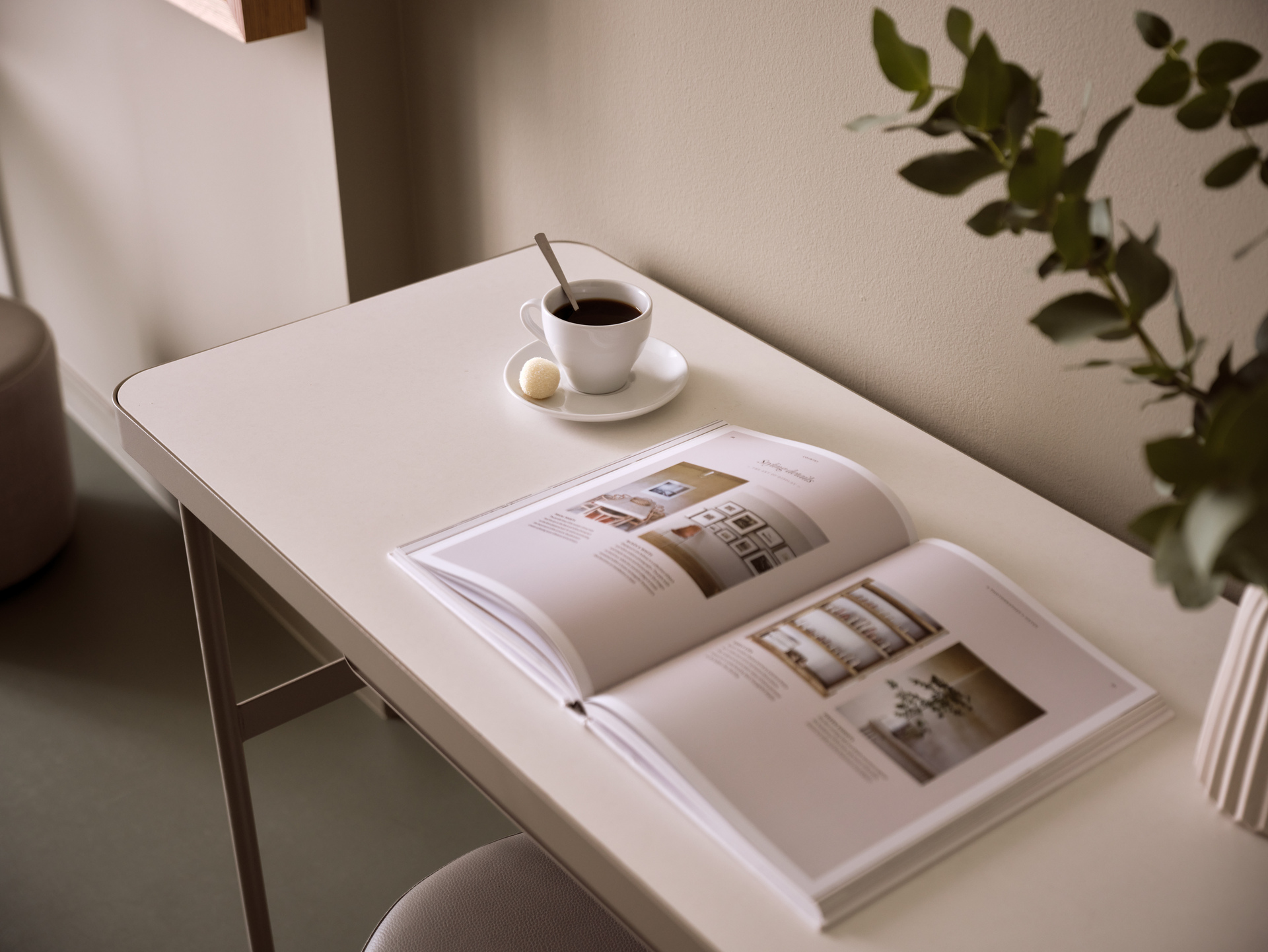 
Superior Room City View at City Hotel with elegant work desk, open magazine, and a cup of coffee