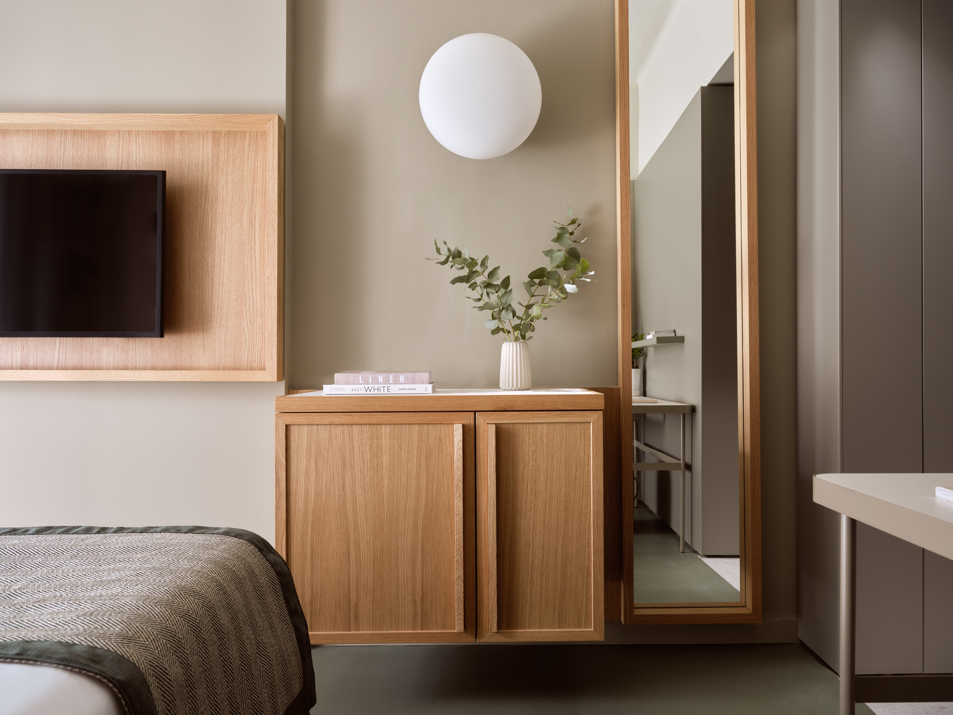 
Standard Room City View at City Hotel with modern decor, wall-mounted TV, and large mirror