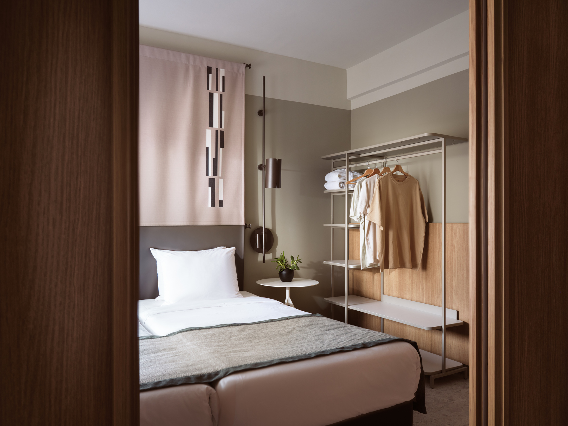 
Junior Suite Inner View at City Hotel with modern bedroom, open wardrobe, and contemporary design
