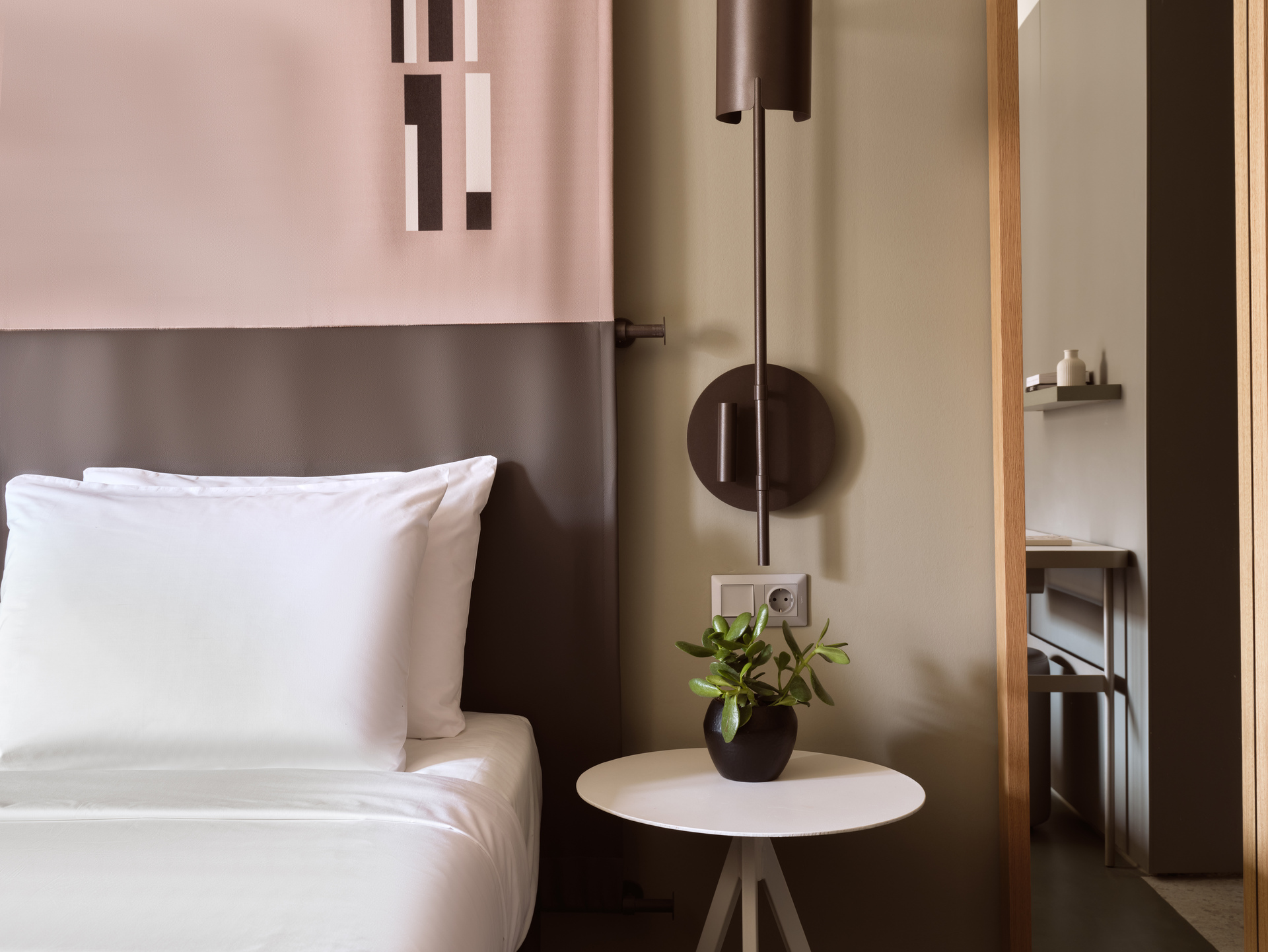 
Superior Room Inner View at City Hotel with comfortable bed, modern lighting, and minimalist side table