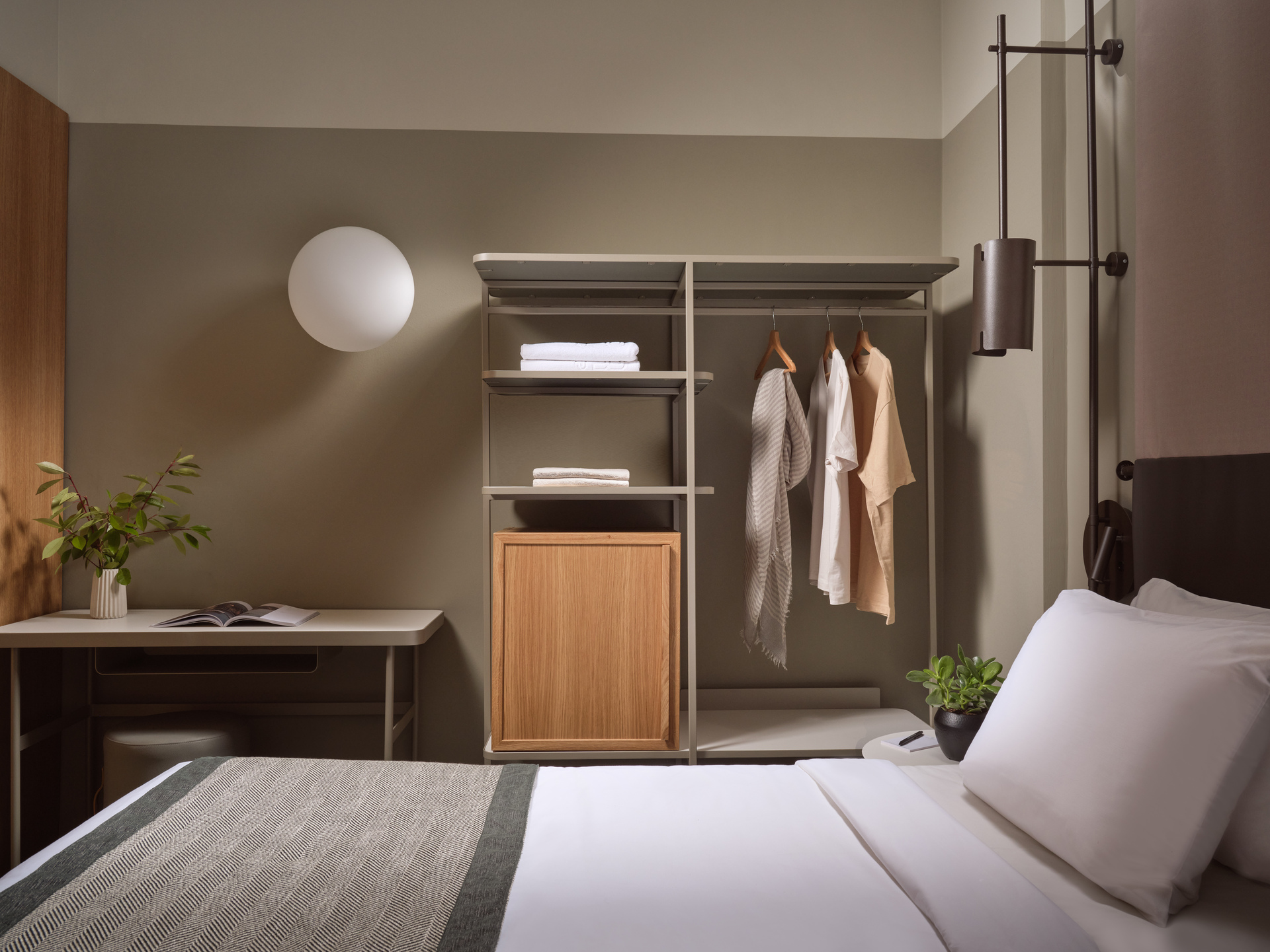 
Standard Room Inner View at City Hotel with modern open wardrobe, cozy bed, and stylish work desk