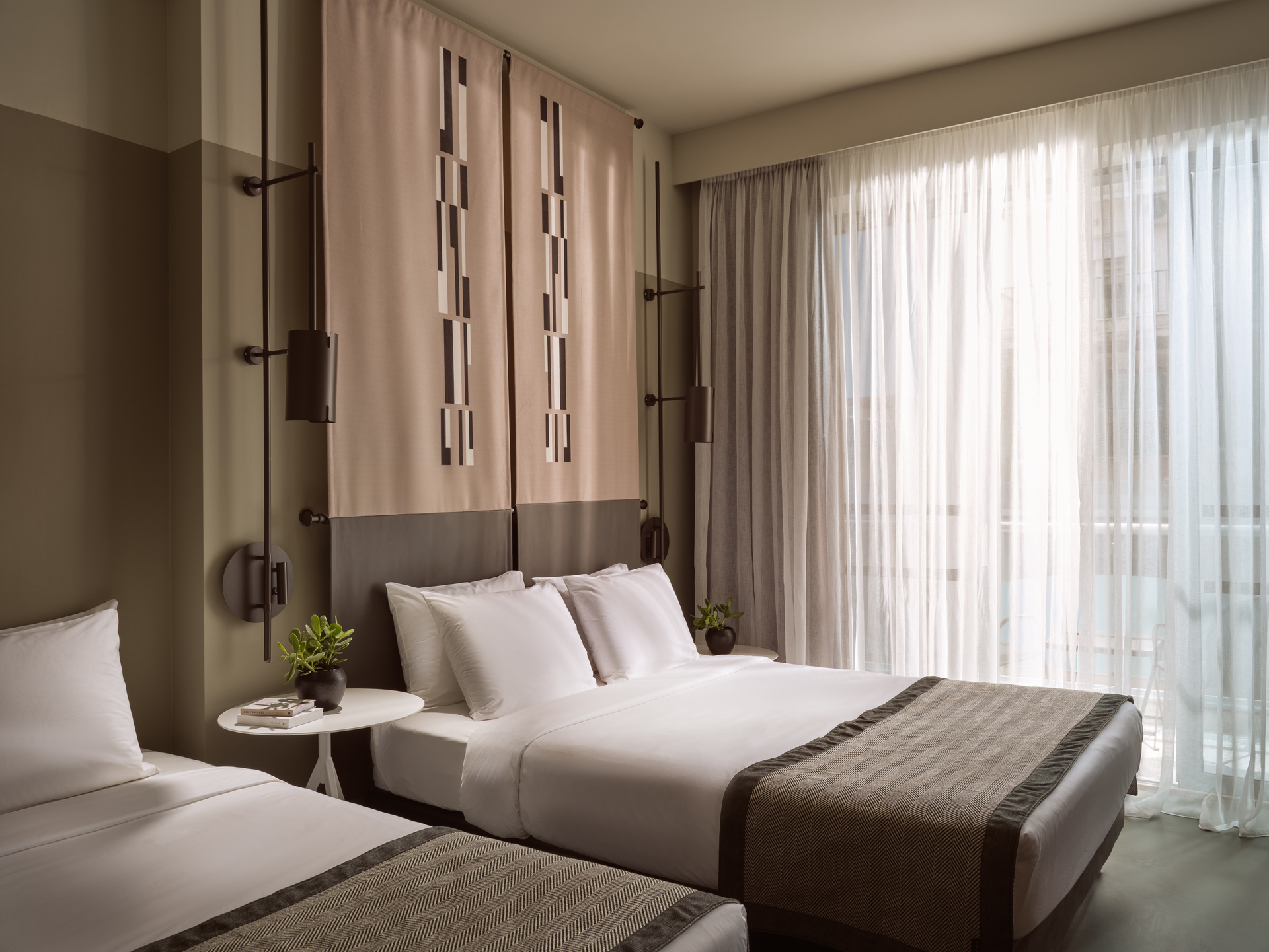 
Superior Room City View at City Hotel with triple beds, modern decor, and floor-to-ceiling window