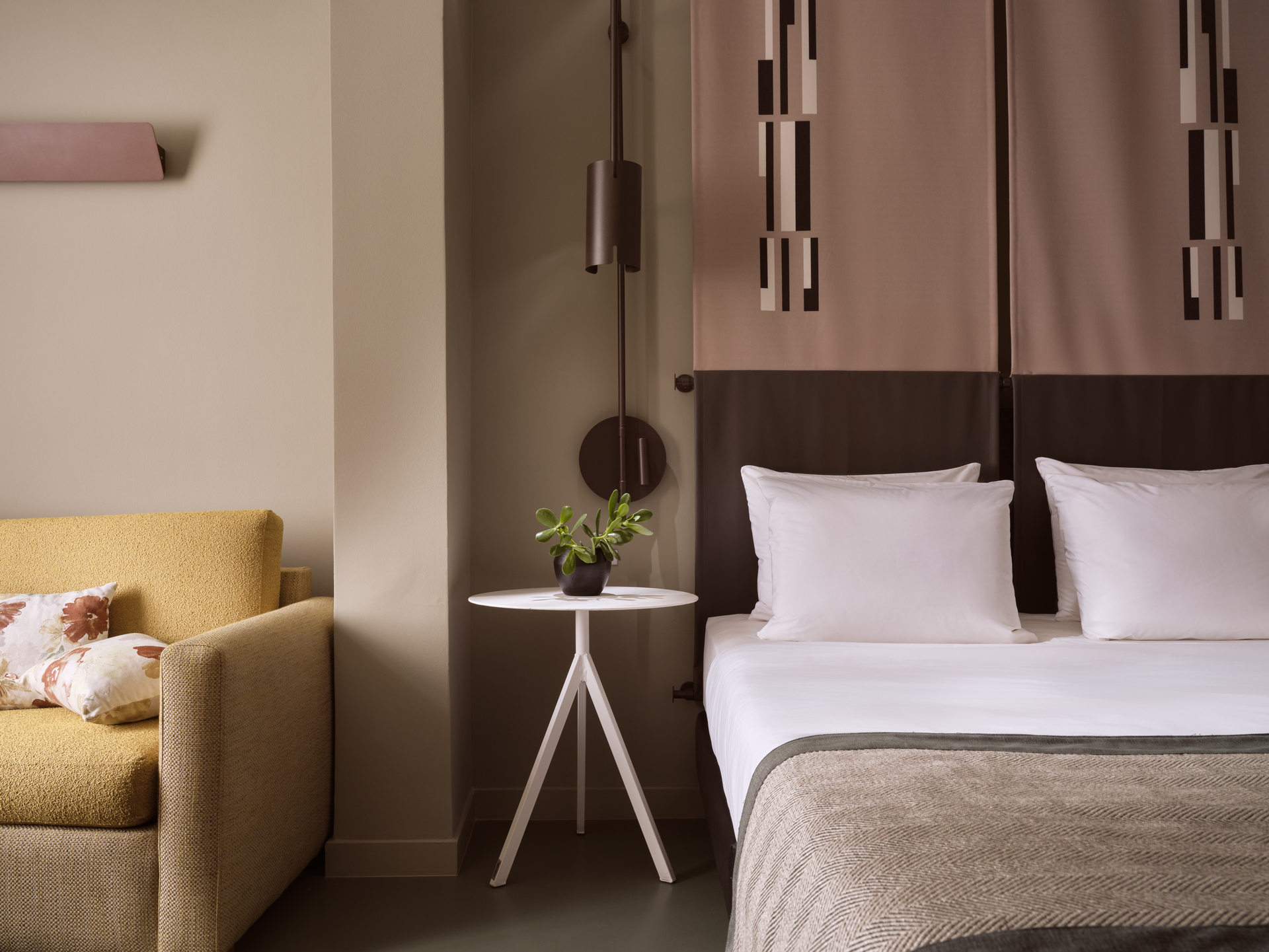 
Junior Suite City View at City Hotel with king bed, modern lighting, and cozy sitting area