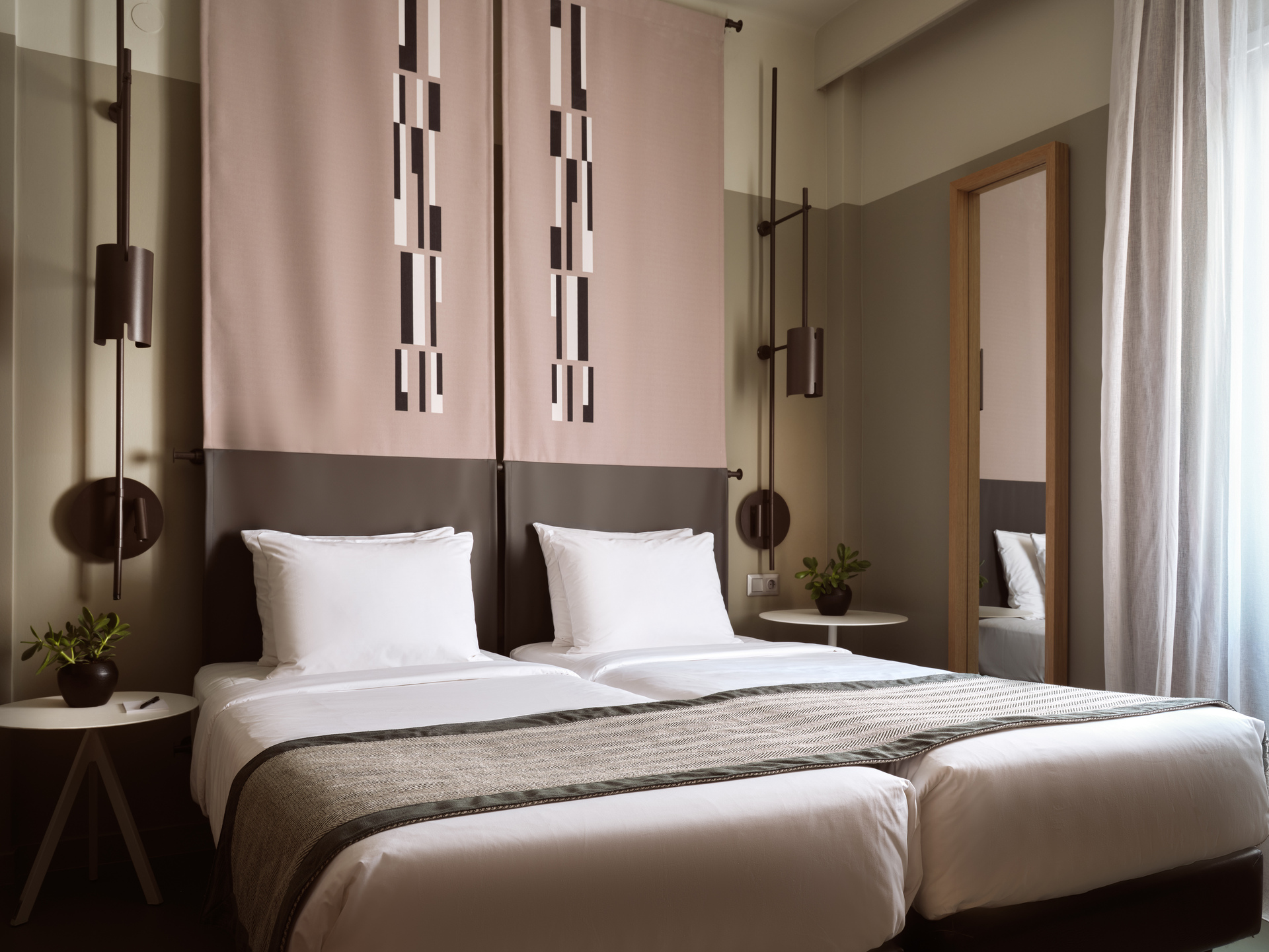 
Standard Room Inner View at City Hotel with twin beds, modern geometric decor, and soft natural light