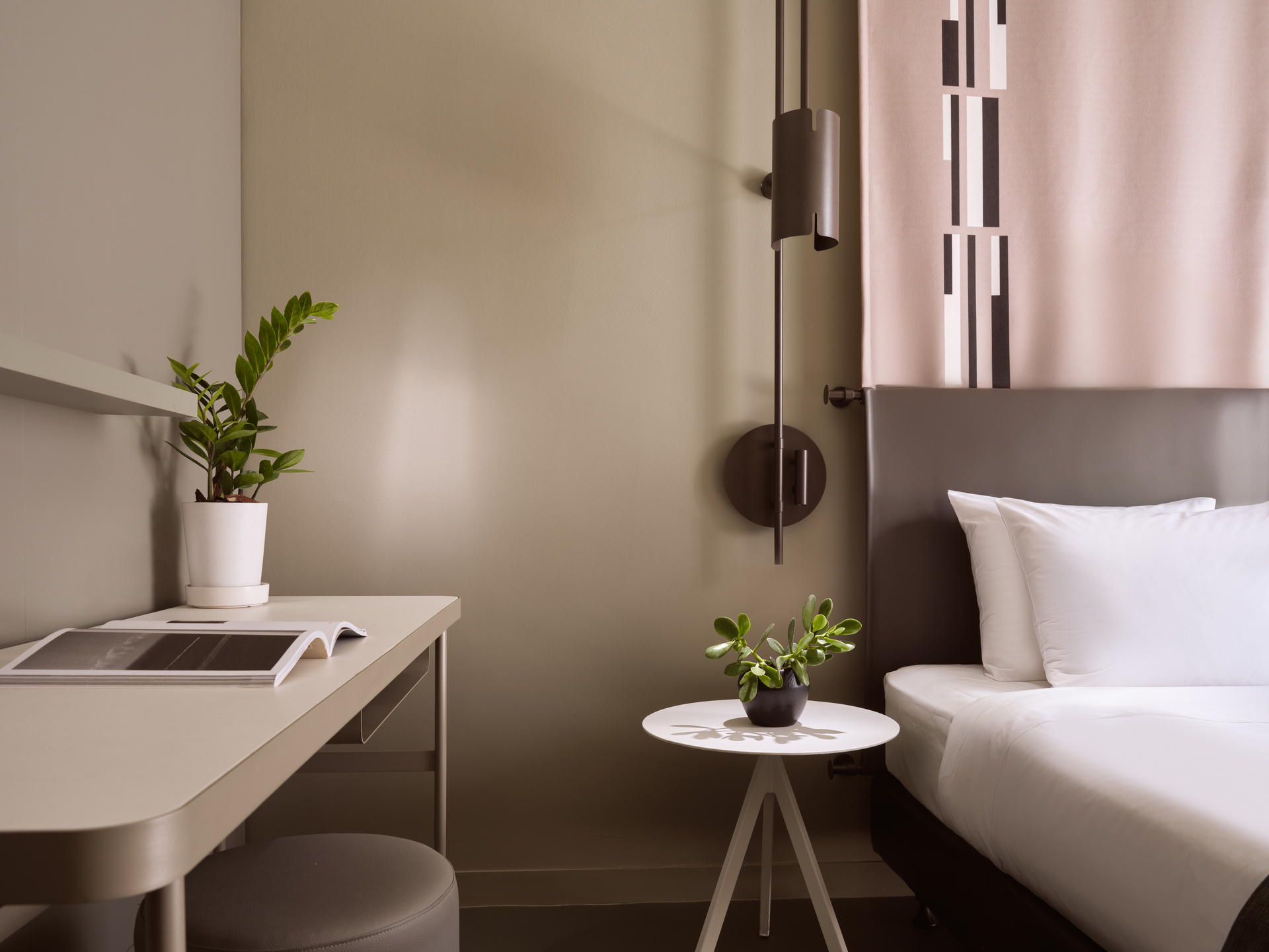 
Standard Room City View at City Hotel with comfortable bed, modern desk, and potted plants