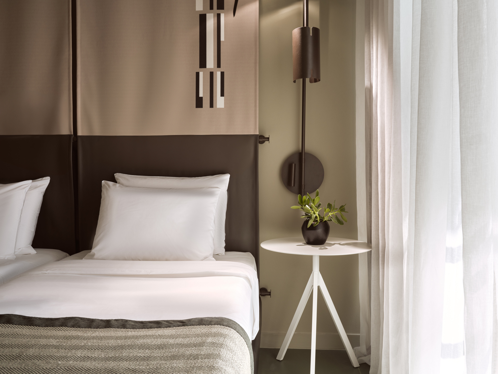 
Standard Room City View at City Hotel with cozy twin bed, soft natural light, and modern side table