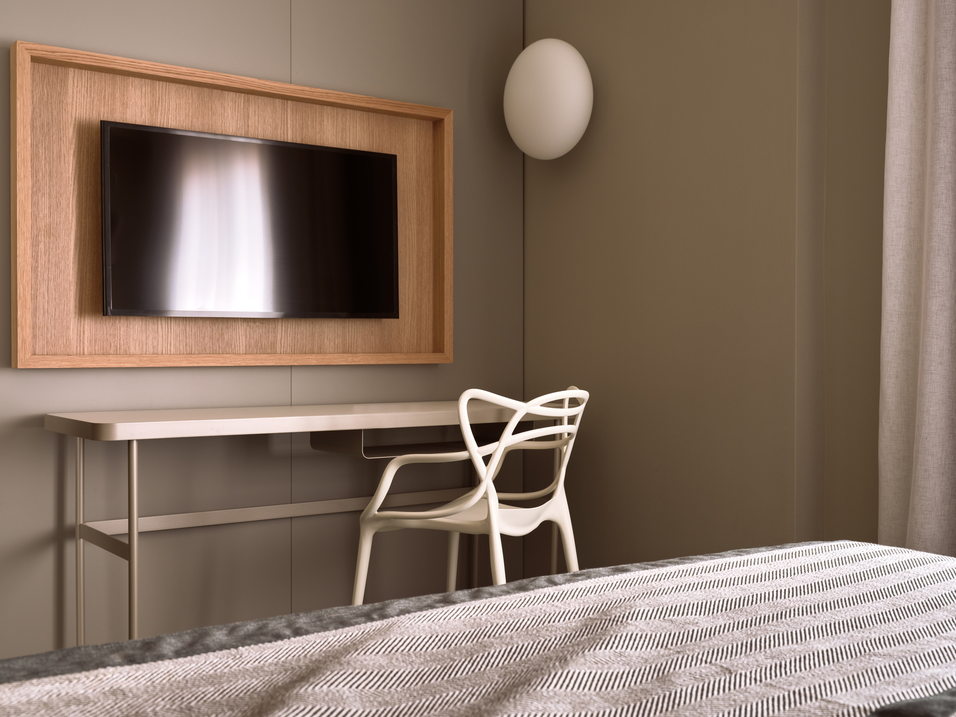 
Standard Room Inner View at City Hotel with wall-mounted TV, modern desk, and designer chair