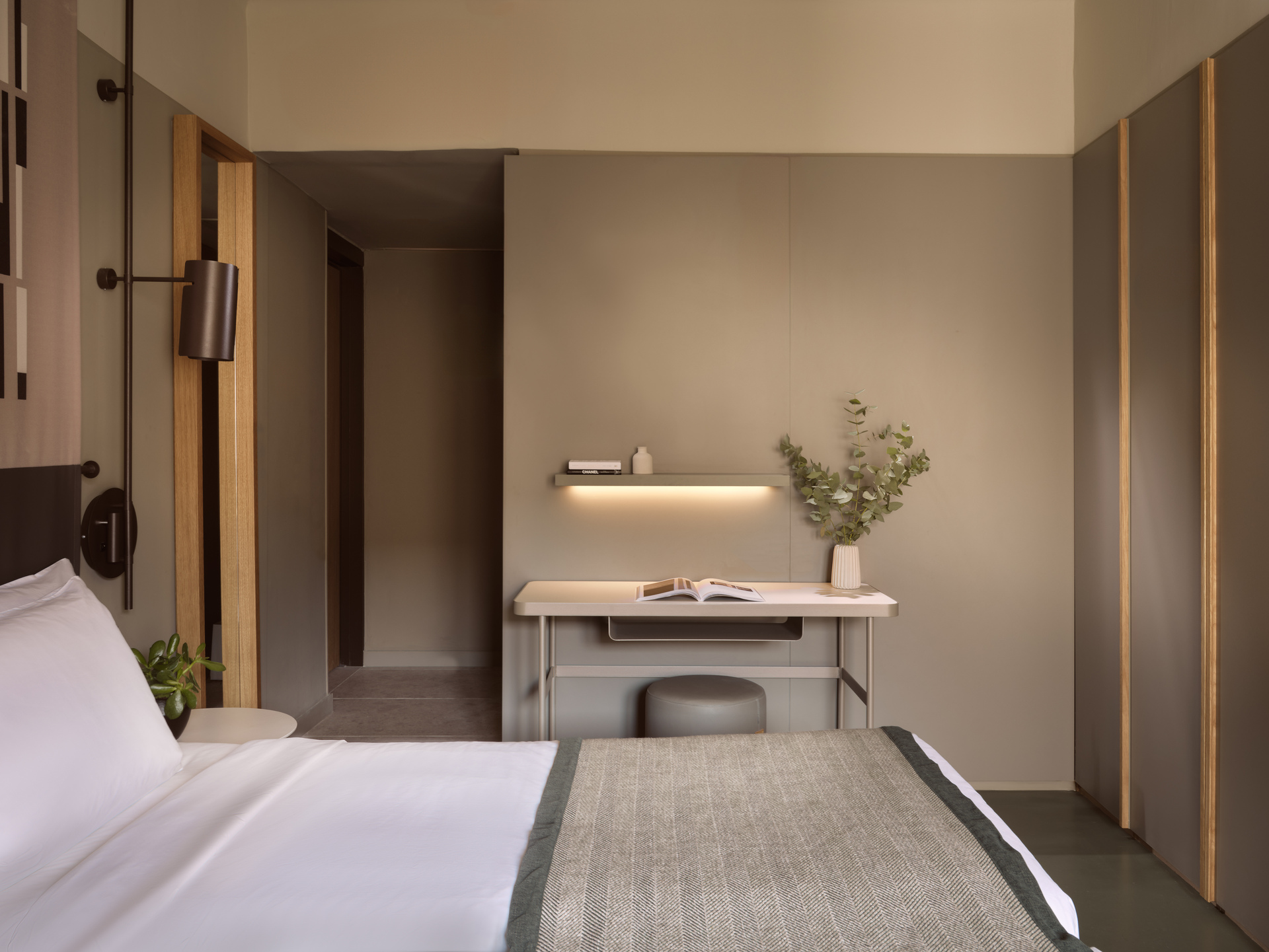 
Superior Room Inner View at City Hotel with comfortable bed, modern work desk, and soft accent lighting